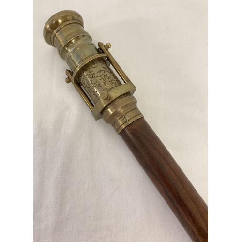 1263 - A reproduction wood and  brass walking stick with swivel top telescope/compass handle.  Approx. 95.5... 