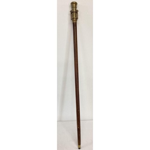 1263 - A reproduction wood and  brass walking stick with swivel top telescope/compass handle.  Approx. 95.5... 