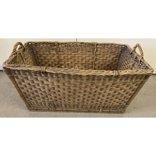 1280 - A large vintage wicker laundry basket with carry handles.  Approx. 38 x 82 x 52cm.