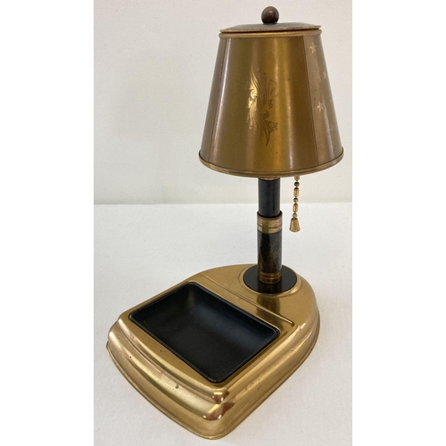 1296 - A vintage metal cigarette dispenser in the shape of a table lamp with ashtray. Star and floral decor... 