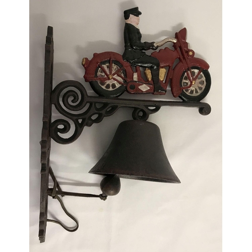 1339 - A modern painted cast metal wall hanging garden bell with motorcycle and rider detail.  Approx. 40cm... 