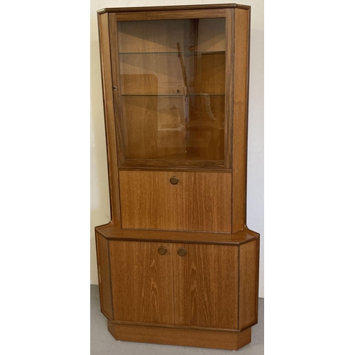 64 - A vintage 1970's teak corner unit with glazed door cupboard, complete with key.  Approx. 170cm tall ... 