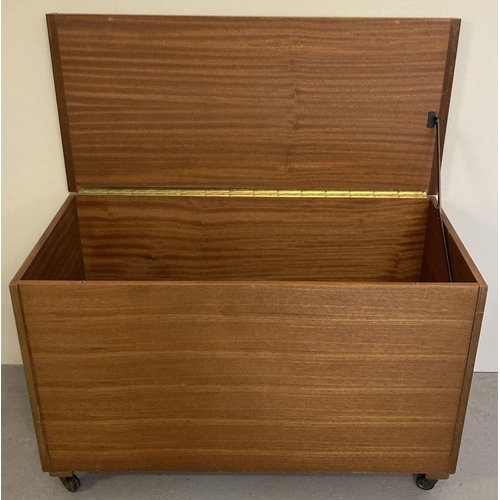 66 - A vintage teak blanket box on castor feet with lift up hinged lid.  Approx. 59cm x 92cm x 43cm.