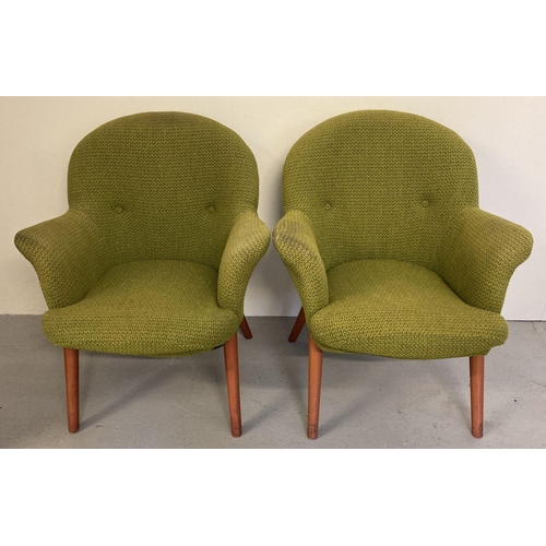 67 - A pair of mid century upholstered armchairs with wooden splayed feet, metal frames and sprung seats.... 