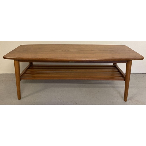 69 - A vintage mid century solid wood coffee table with slatted undershelf and tubular legs. Medium oak t... 