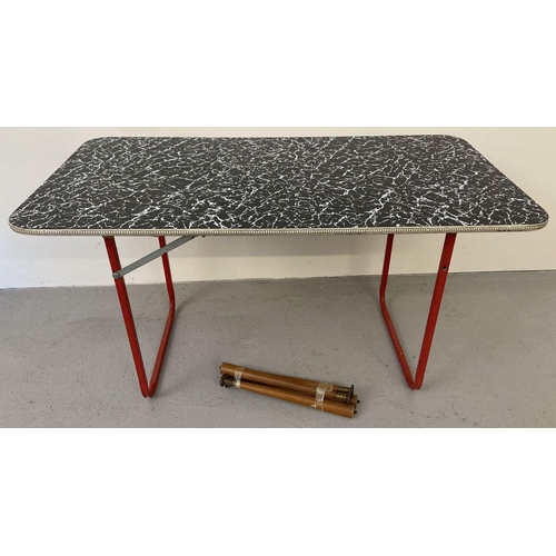 73 - A 1960's rectangular shaped, black and white patterned, Formica topped coffee table. With gold colou... 