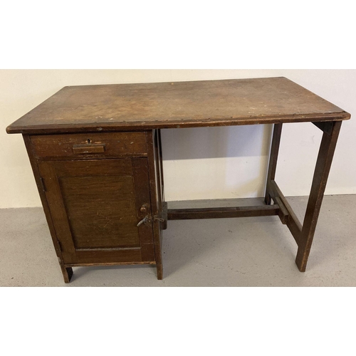 78 - A vintage 1940's dark oak framed Utility desk with single drawer and cupboard.  Approx. 70cm tall x ... 