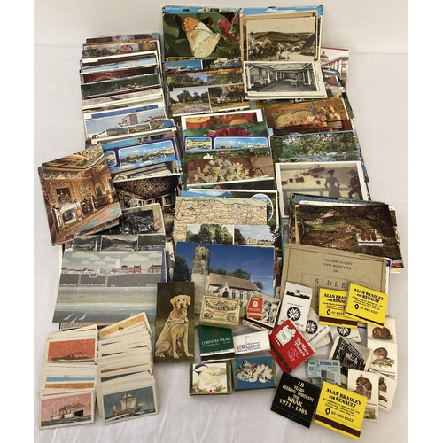 180 - A shoe box of assorted vintage ephemera to include a quantity of assorted postcards, matchboxes and ... 