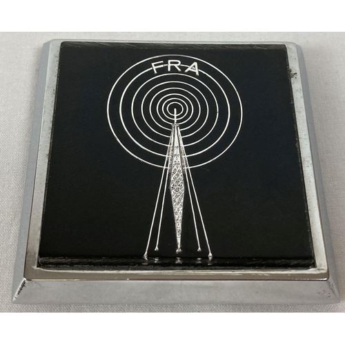 286 - A Free Radio Association car badge with fixings. Radio tower detail with FRA above radio waves.