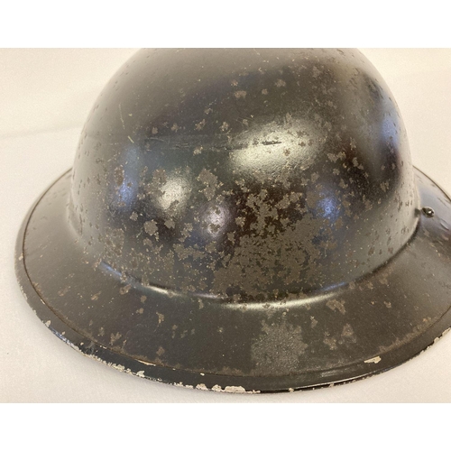 1204 - WW2 British MkII steel helmet, painted black for Home Front use, stencilled in white 'FAP'. First Ai... 