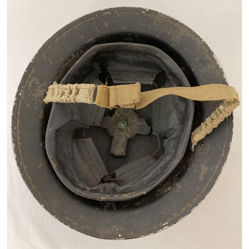 1204 - WW2 British MkII steel helmet, painted black for Home Front use, stencilled in white 'FAP'. First Ai... 
