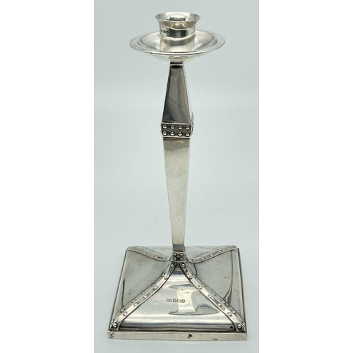 1116 - An Arts & Crafts silver candlestick with studded detail, square shaped base & circular bobeche. Full...