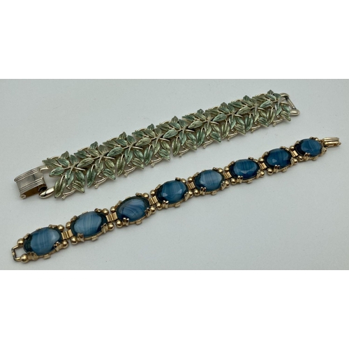 225 - 2 vintage costume jewellery bracelets. A green and gold tone leaf design together with a gold tone b... 