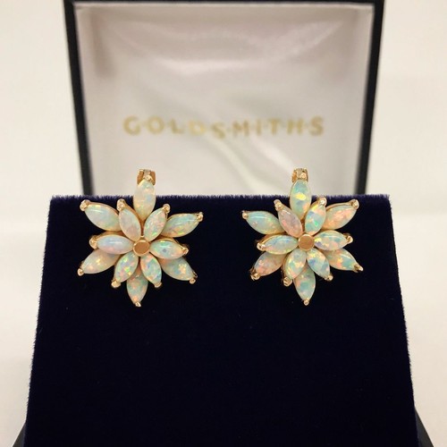 11 - A boxed pair of 14ct rose gold flower design earrings set with marquise cut fire opals.  Leverback e...