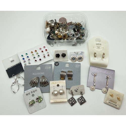 241 - A collection of 50+ pairs of vintage and modern costume jewellery earrings in varying styles. Mostly... 