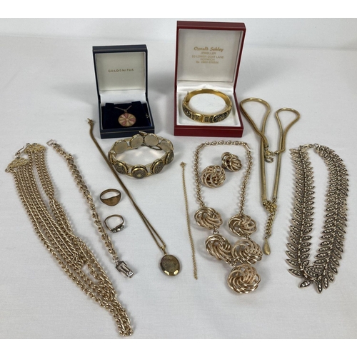 243 - A quantity of assorted vintage gold tone costume jewellery. To include necklace and matching earring... 