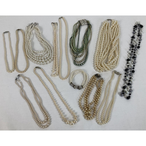 244 - A collection of 12 vintage faux pearl necklaces in varying colours and lengths. To include double an... 