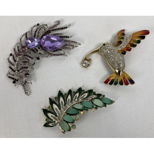 246 - 3 large costume jewellery statement brooches. An enamel and stone set humming bird, a leaf design se... 