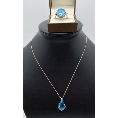 37 - A Swarovski blue crystal and silver pendant style necklace together with a decorative swivel top whi... 