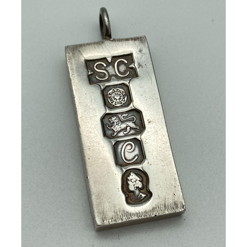 67 - A large vintage silver ingot commemorative pendant with hallmark detail to front. Hallmarked Sheffie... 