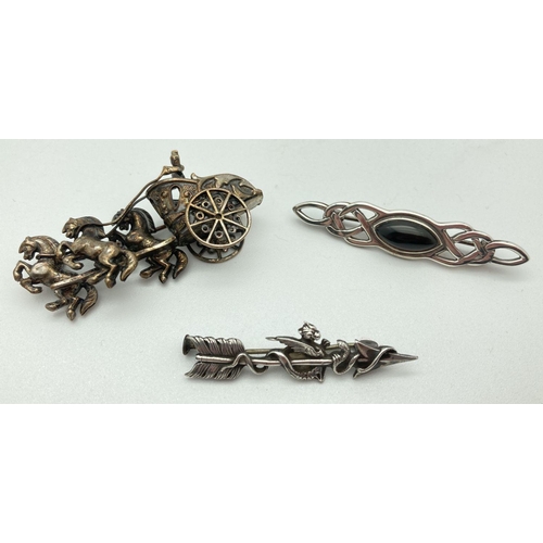 83 - 3 vintage silver and white metal brooches. An arrow sweetheart brooch with baby dragon detail, a Cel... 