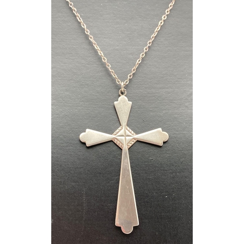 86 - A large vintage silver decorative cross pendant on a 22 inch fine belcher chain. Pendant marked Ster... 