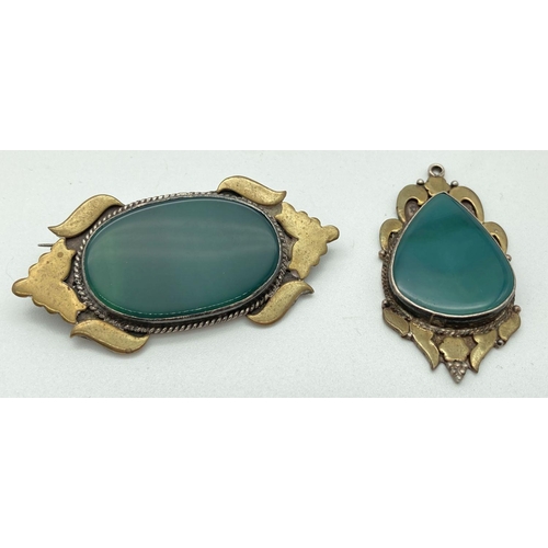 87 - A vintage ethnic design silver and brass pendant and matching brooch, each set with green agate. Bac... 