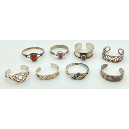 94 - A collection of 6 silver and white metal toe rings together with 2 child's white metal dress rings. ... 