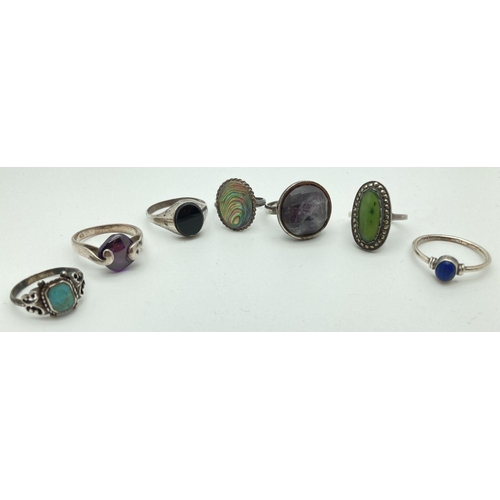 99 - 7 stone set silver dress rings in varying styles and sizes. To include quartz, turquoise, amethyst, ... 