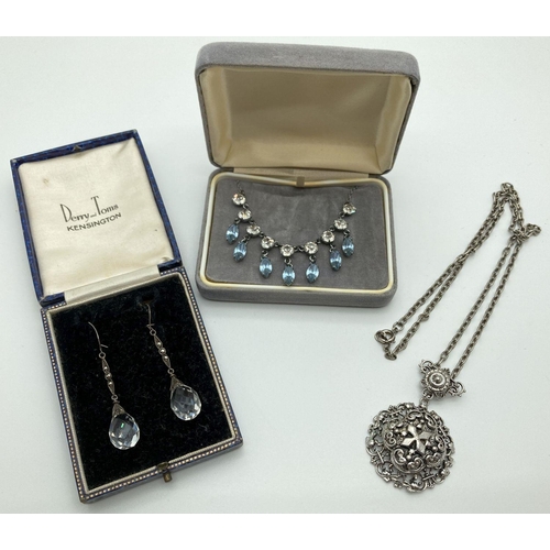 273 - 3 items of vintage costume jewellery. A clear & blue stone set diamanté necklace, a pair of glass be... 