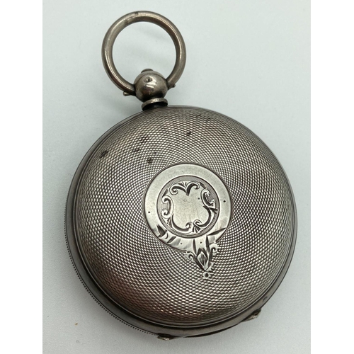 288 - An early 20th century silver cased pocket watch, in working order, complete with key. Enamelled face... 