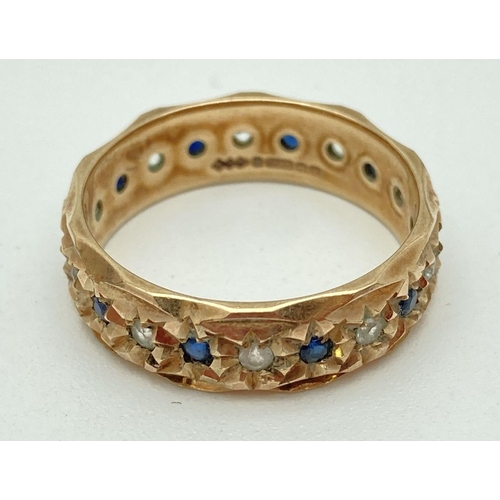 126 - A vintage 9ct gold full eternity ring with diamond cut pattern and set with small round cut alternat... 