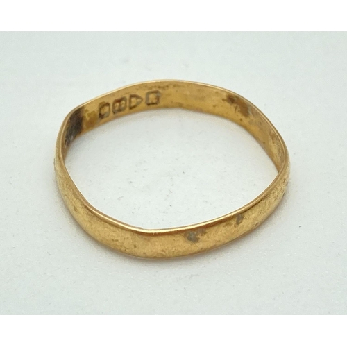 133 - A 22ct gold 3mm wedding band. Needs reshaping. Ring size O. Approx. 1.6g.