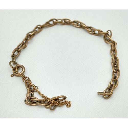 140 - A vintage 9ct scrap gold multi link bracelet with safety chain. Hallmarks to fixing. Total weight ap... 