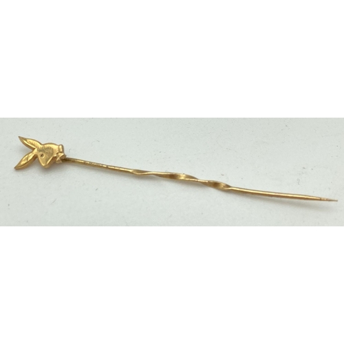 141 - A 9ct gold Playboy Bunny stick pin. Hallmarks to side of pin. Total weight approx. 0.4g.