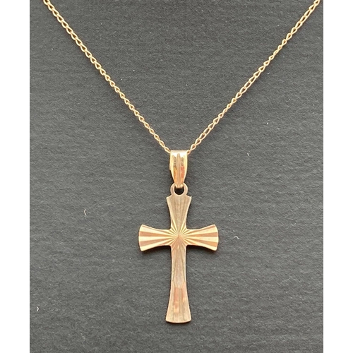 165 - A 9ct gold vintage style cross with sunray detail to front. On a 20 inch fine belcher chain with spr... 