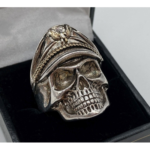 173 - A large silver skull ring, stamped 925 to inside. Ring size W. Boxed. Weight approx. 13.9g.