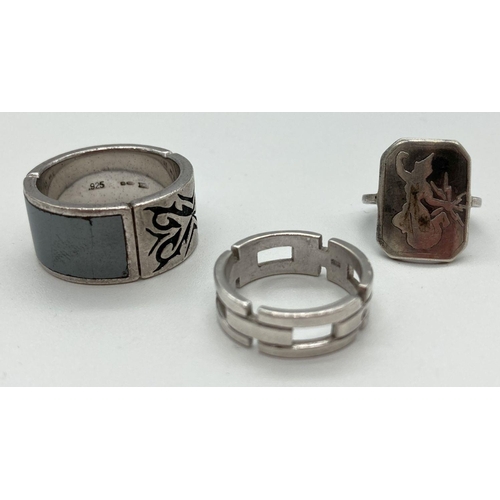 178 - 3 silver rings. A man's band ring with hematite panel, a chain style band ring and a dress ring with... 