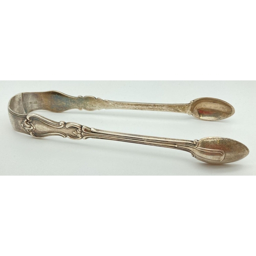 333 - A large pair of Elizabeth Eaton Victorian silver sugar tongs with decorative arms. Fully hallmarked ... 