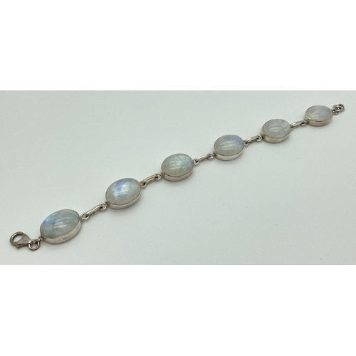 197 - A modern design silver and moonstone bracelet with lobster style clasp. Set with 6 round cut moonsto... 