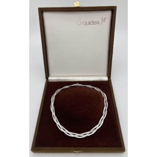 198 - A vintage boxed triple strand, plaited design silver necklace with brushed effect finish. Push clasp... 