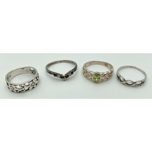 205 - 4 silver band style and stone set dress rings. A band with twist detail to top, a band with pierced ... 