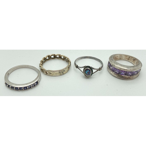 207 - 4 silver dress rings. A chain style band with empty cartouche, oval Paua shell set ring, band style ... 