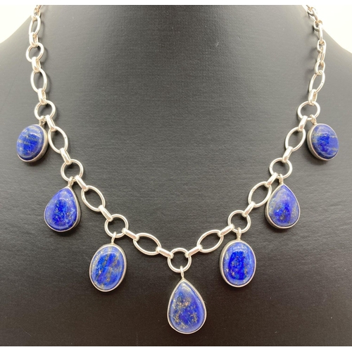 208 - A modern design silver and lapis lazuli necklace with T-bar clasp. A large belcher style chain with ... 