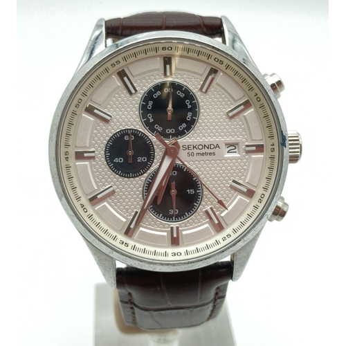 292 - A men's Sekonda chronograph style wristwatch with brown leather strap. Stainless steel case with sil... 