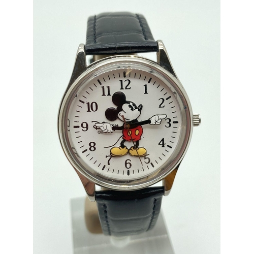 299 - A Disney Time Works Mickey Mouse wristwatch with moving arms for hour and minutes hands. Stainless s... 