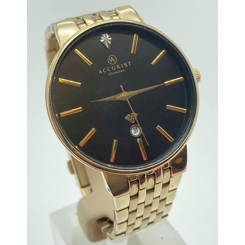 300 - A men's gold tone bracelet strap wristwatch by Accurist. Black face with gold tone hour markers and ... 