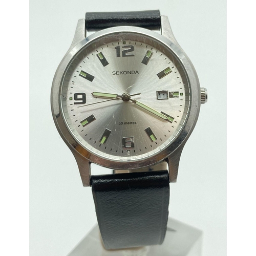 304 - A men's Sekonda wristwatch with stainless steel case and black leather strap. Silver tone face with ... 