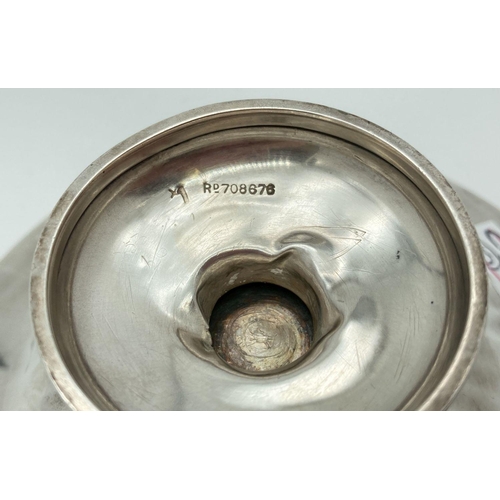 335 - A 1920's silver bon bon dish with galleried rim and raised on a pedestal foot. Engraved to base of b... 