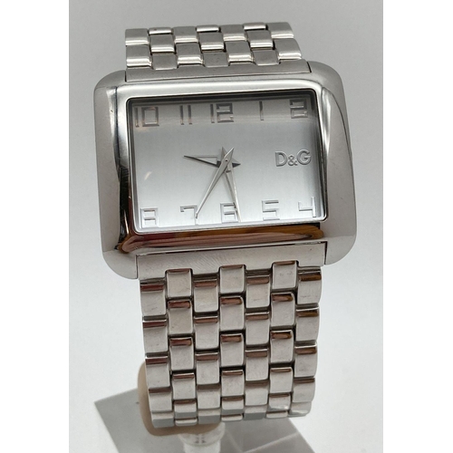 310 - A Dolce & Gabbana stainless steel strap wristwatch with square case and face. Pale silver tone hour ... 